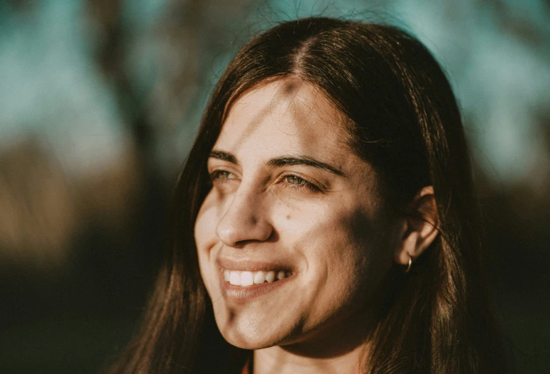 a close up of a young woman smiling