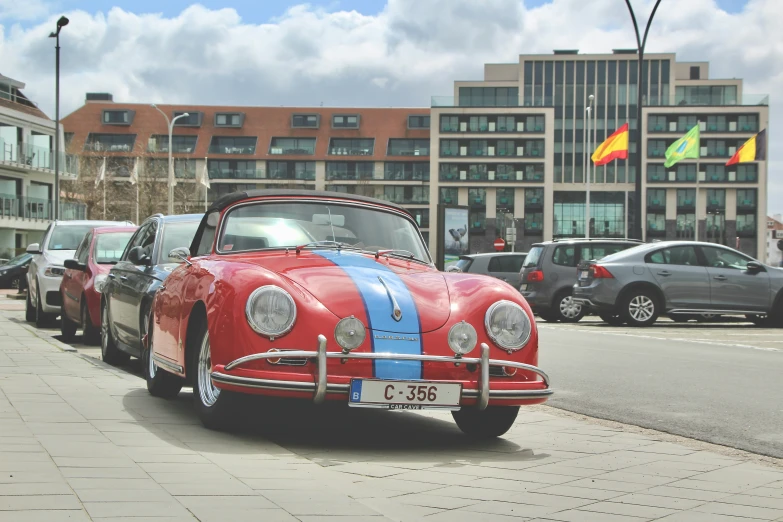 there is a red car with stripes painted on it