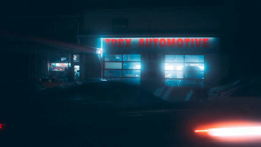 a dark po of a liquor store lit up with bright lights