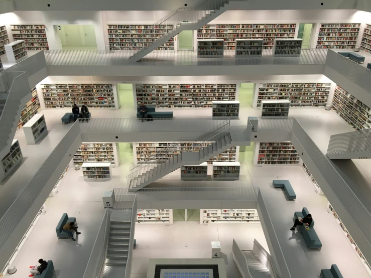 the top view of an open air liry with two people reading