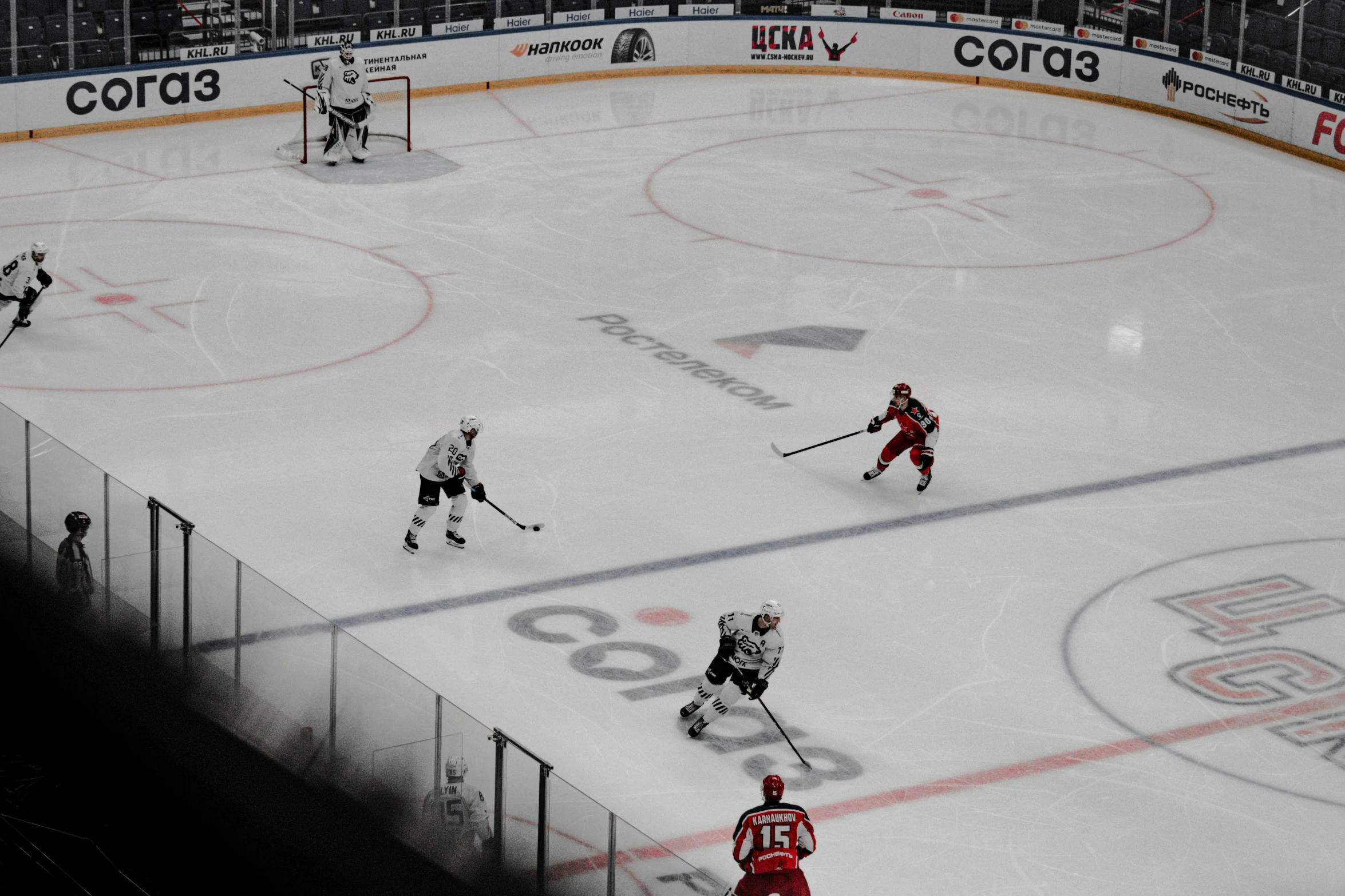 a hockey game on a large ice rink