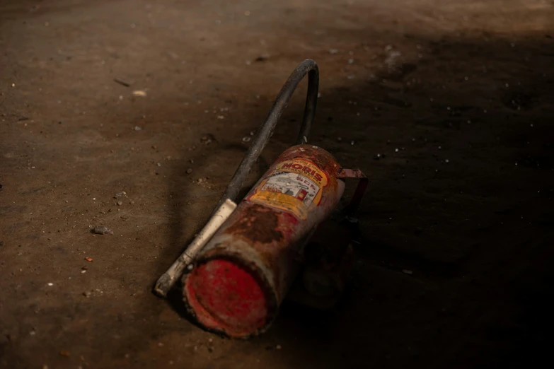 an old broken up beer bottle in the dirt