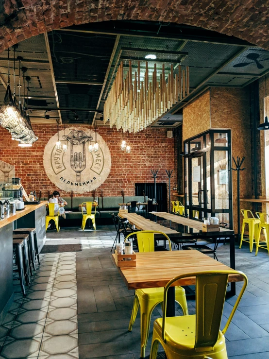 the inside of a restaurant with tables and chairs