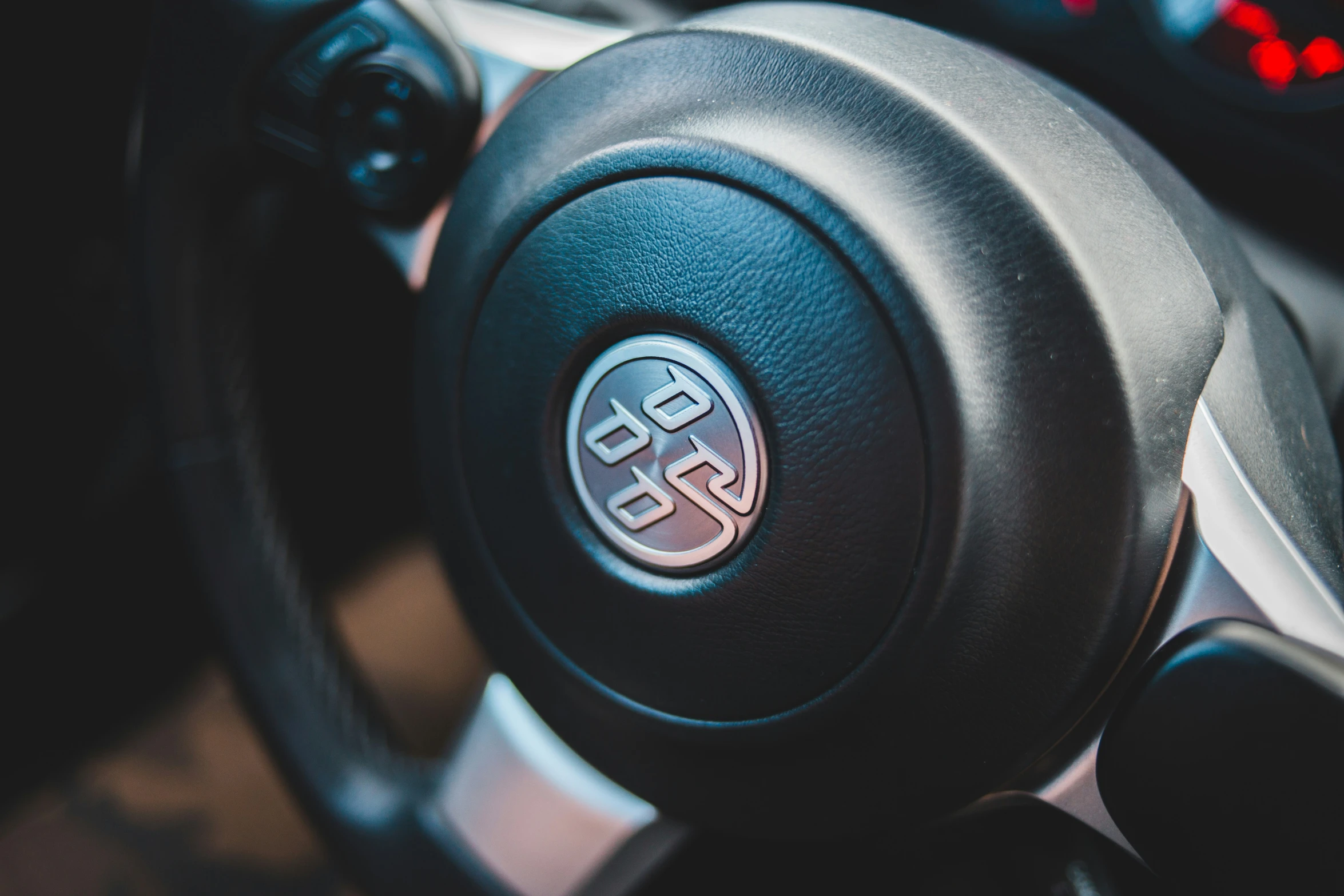 steering wheel with ons and black cloth on car