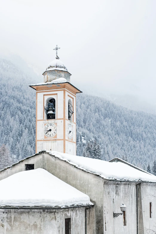 a clock tower stands on top of a building