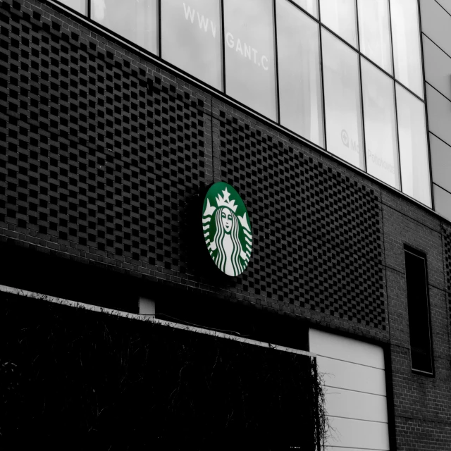 there is a starbucks sign on the side of the building