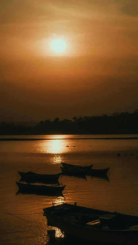 three boats that are sitting in the water