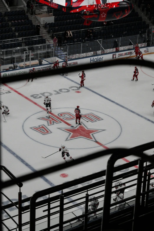 a hockey team at the net on the ice