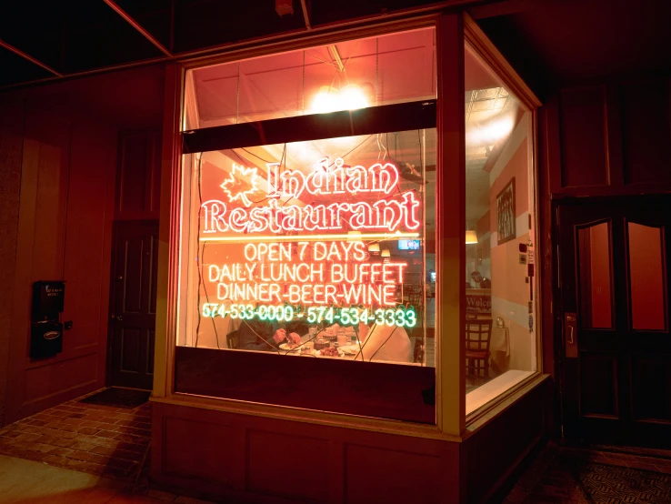 a restaurant sign advertising dinner buffet and beverage