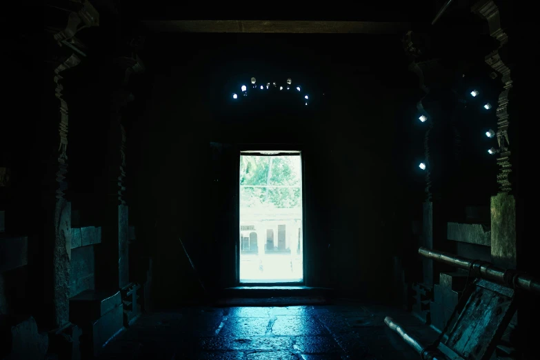 a small room with a dark, creepy looking entrance