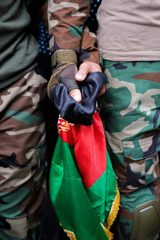 a soldier holding the colors of his uniform