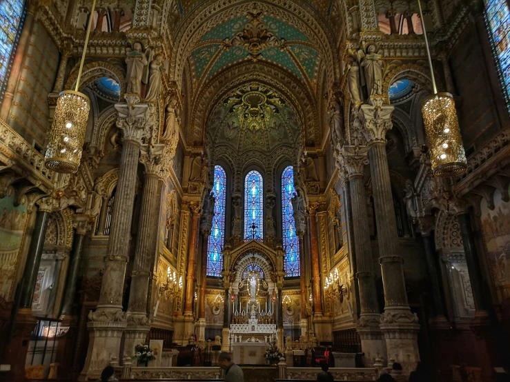 the inside of a large cathedral with two windows