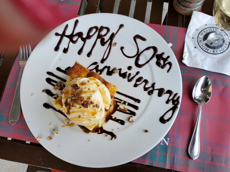 a birthday cake sits on a table at a restaurant