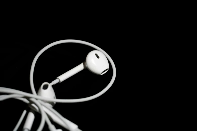 an earphone that has a cord that is connected to it