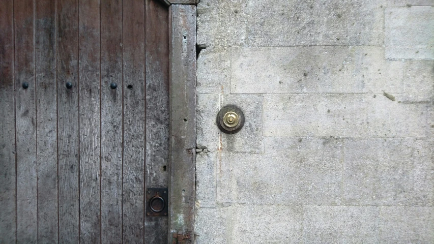 the door to an old building is brown