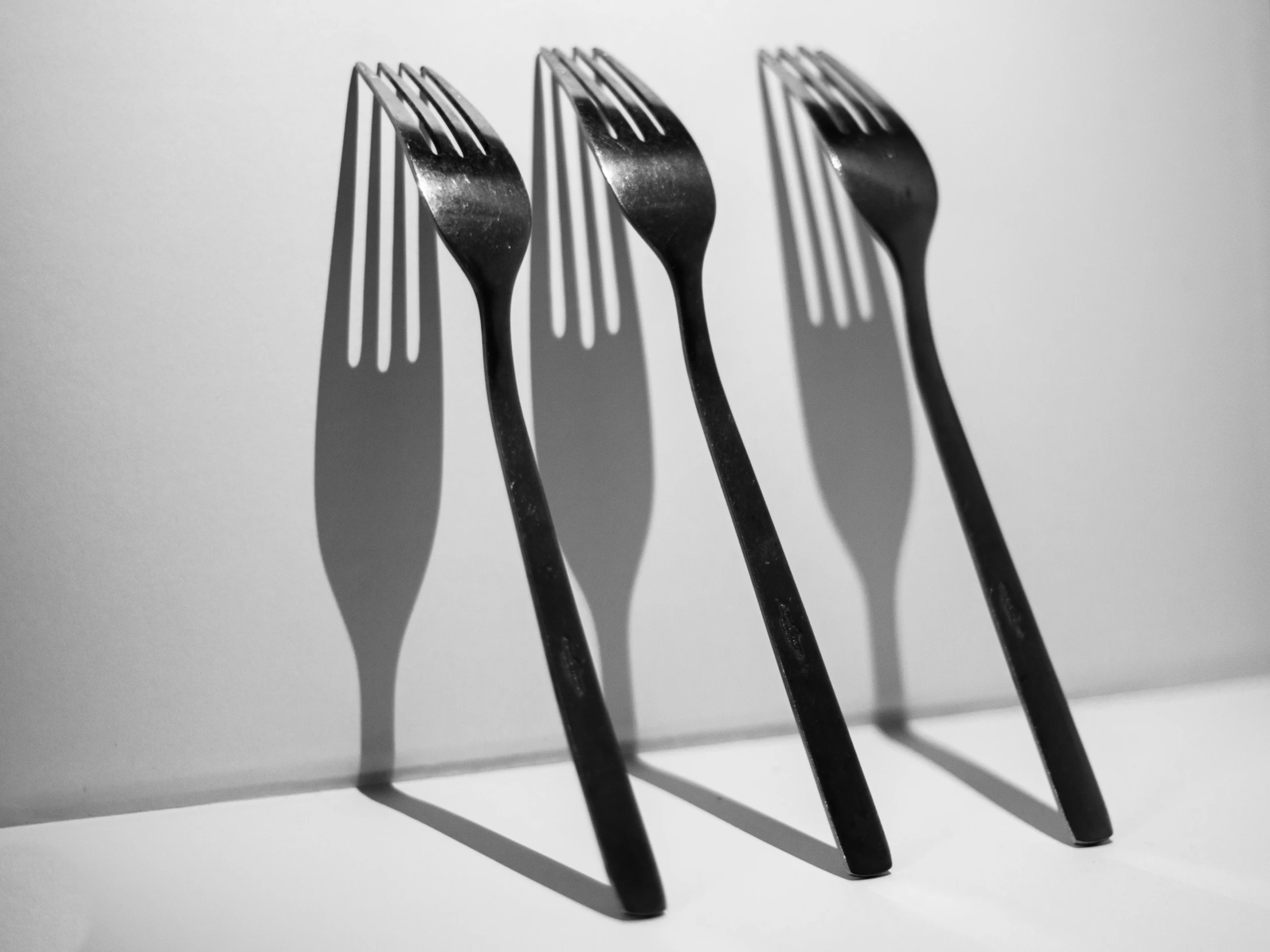 the shadow is cast on three forks, and is very white