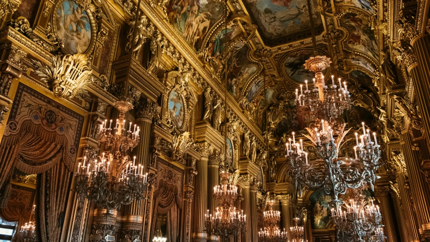 some gold painted wood and ornate chandelier in a building