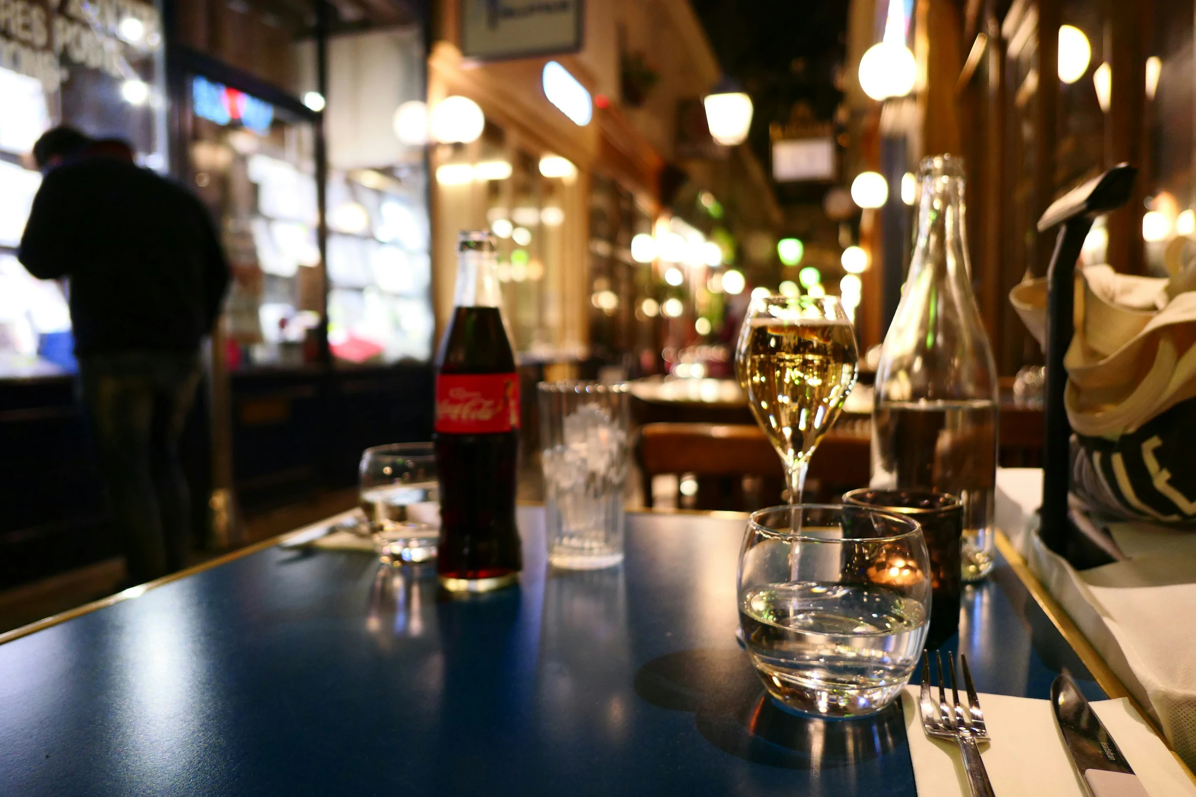 a table with glasses on it near bottles