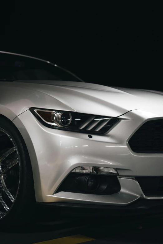 a car is sitting on a street at night