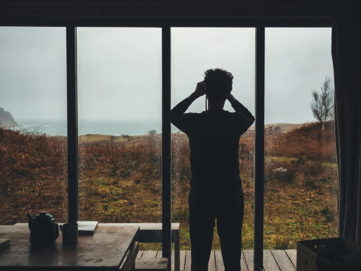 a person standing at the top of a porch