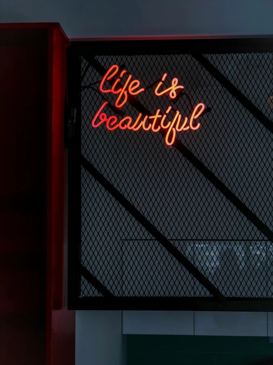 a red sign that says life is beautiful on it