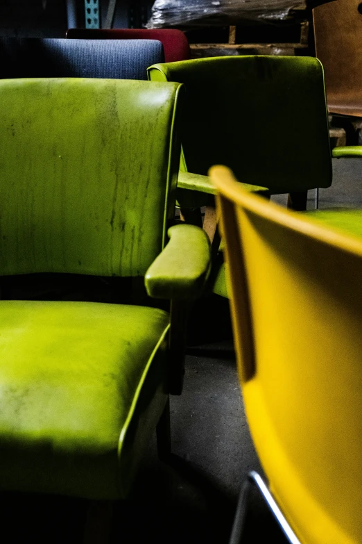 an array of different colored chairs in a restaurant