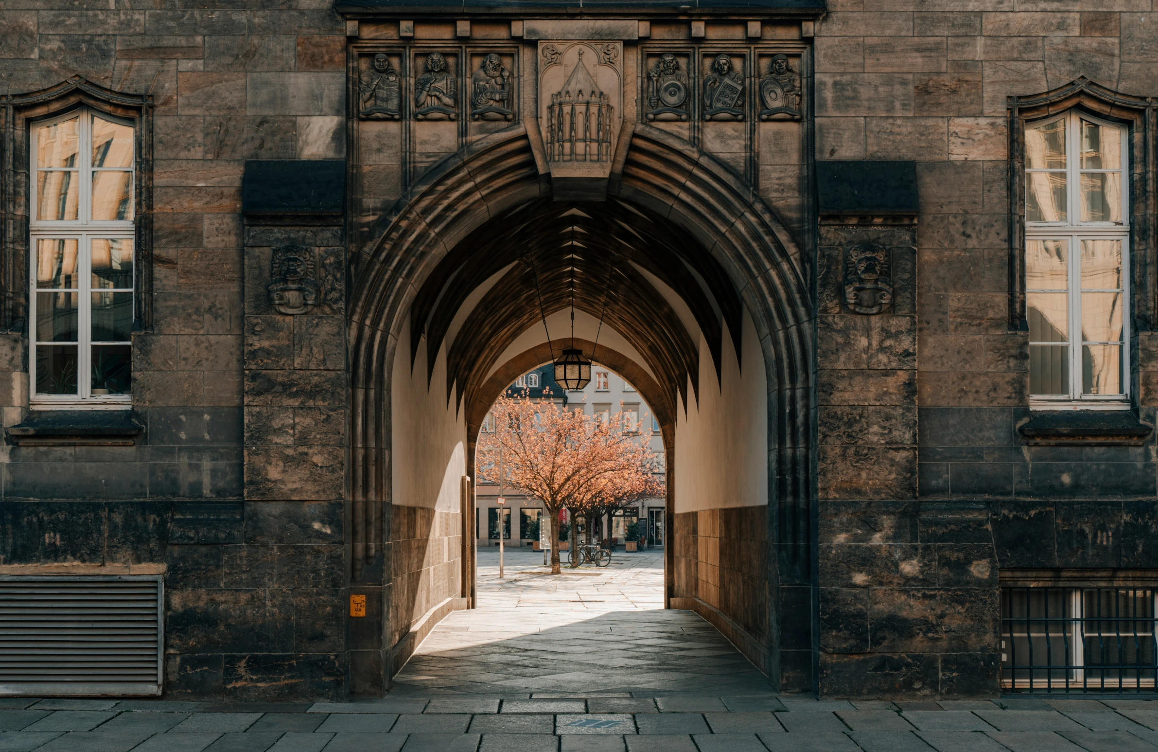 an entrance to a large brick building