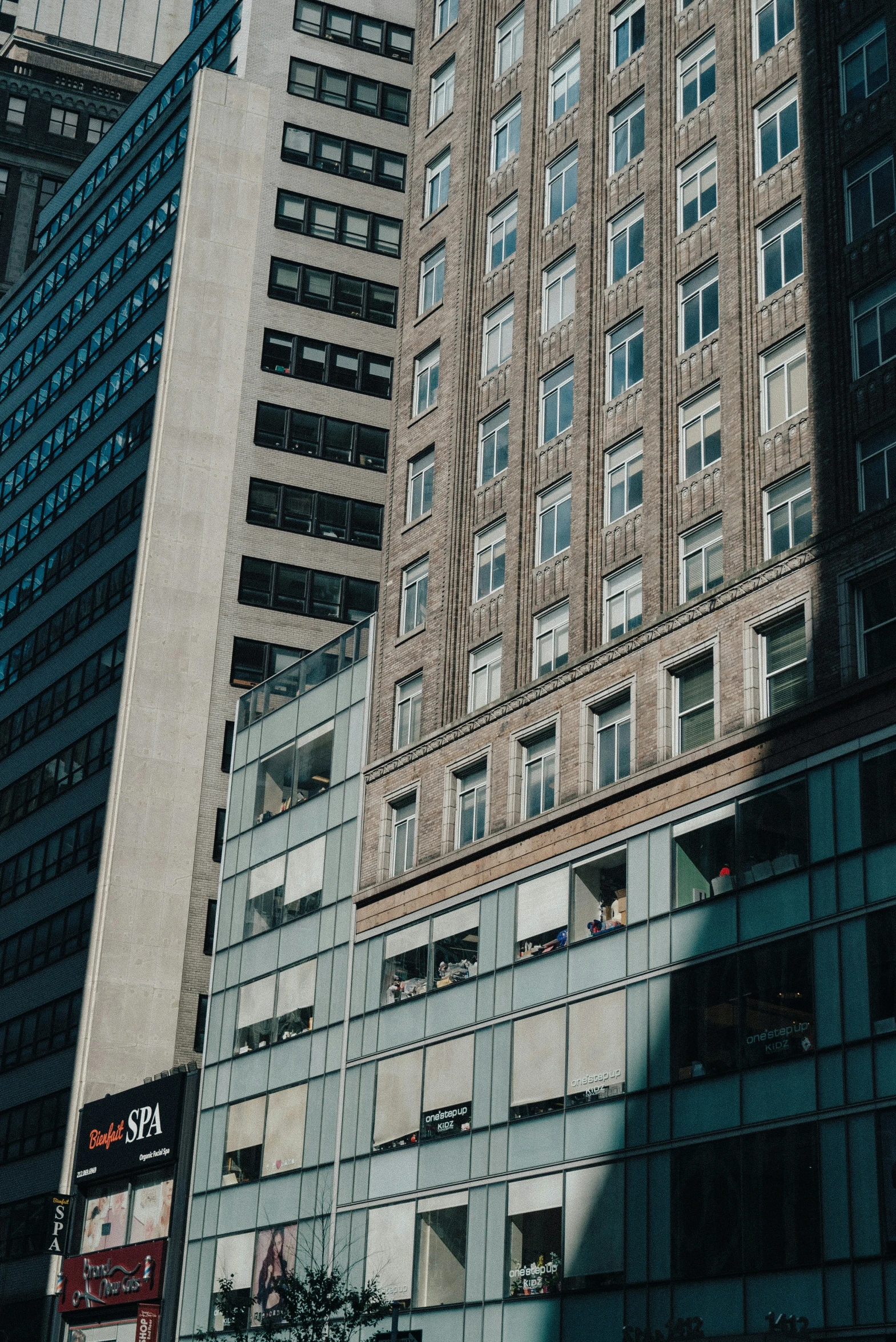 three different tall buildings are in the background