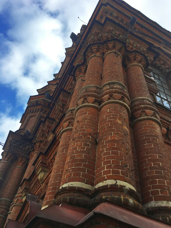 this is a tall brick building with a clock on it's side