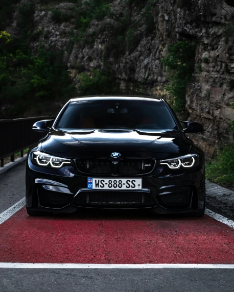 the front of the black bmw m4 coupe