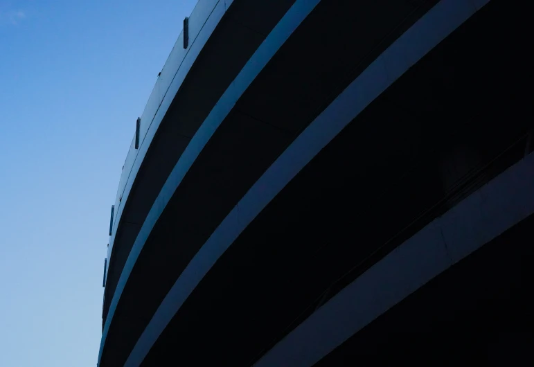 a large jetliner flying next to a tall building