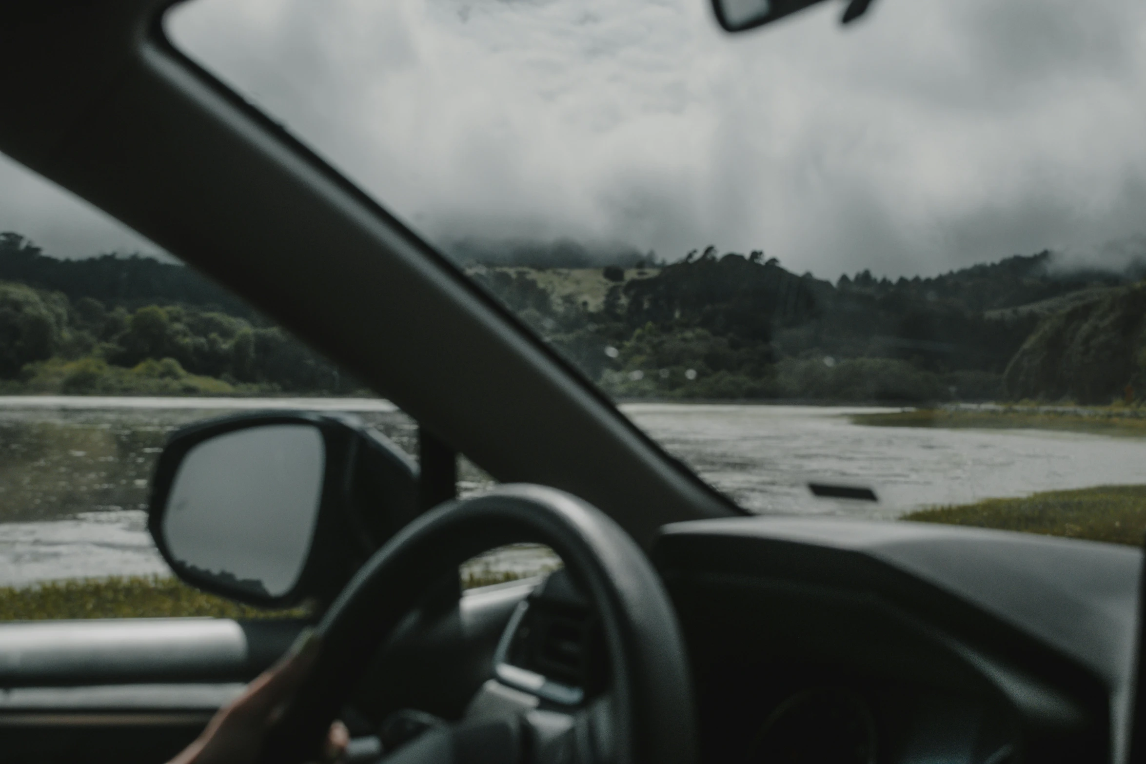 a view from a car driving in front of a person