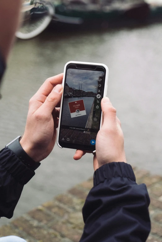 a person holding up their cell phone to take a picture