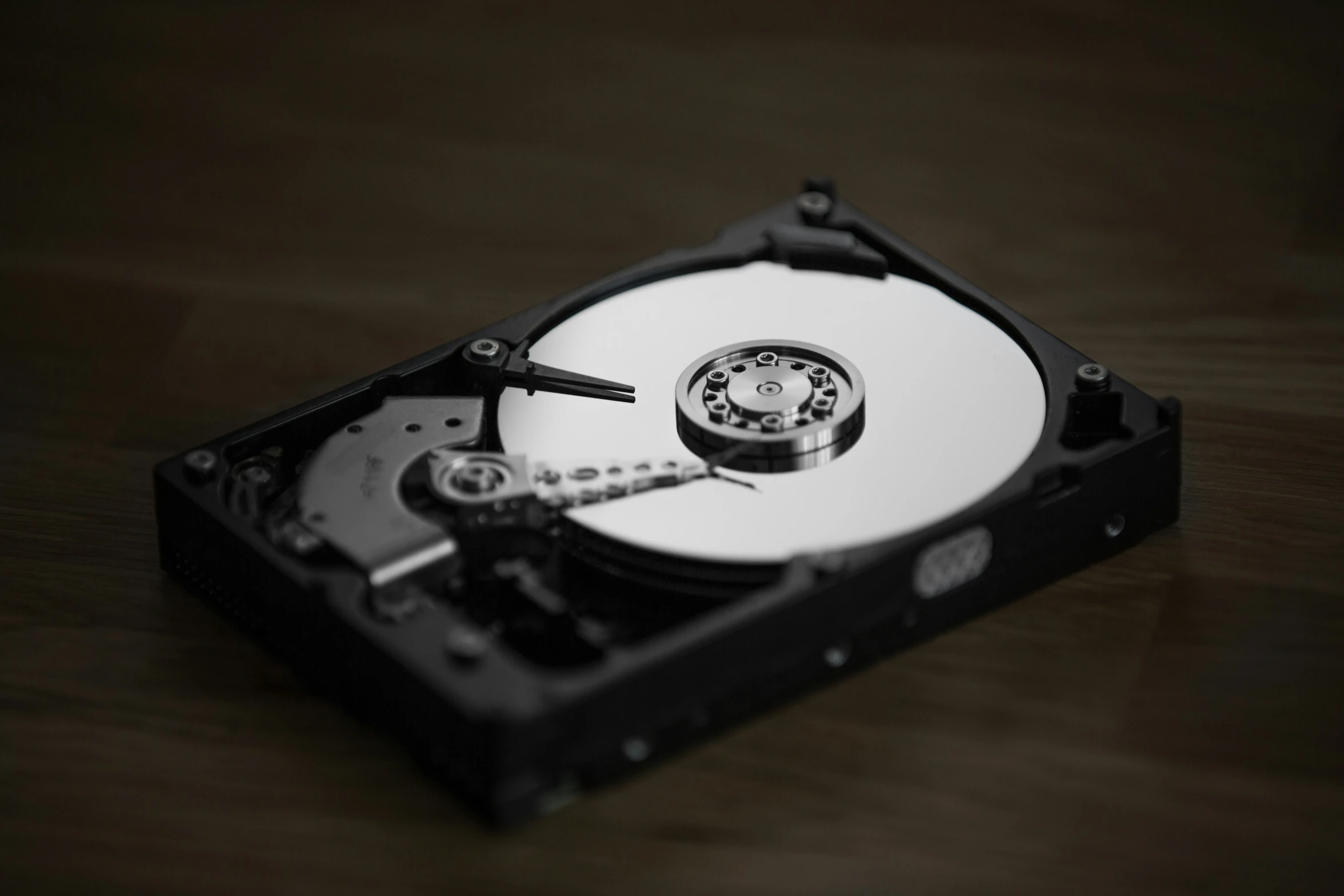 a hard drive being held open on a table