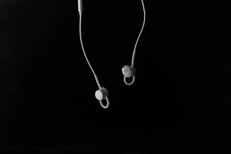 a pair of headphones hanging from a cord