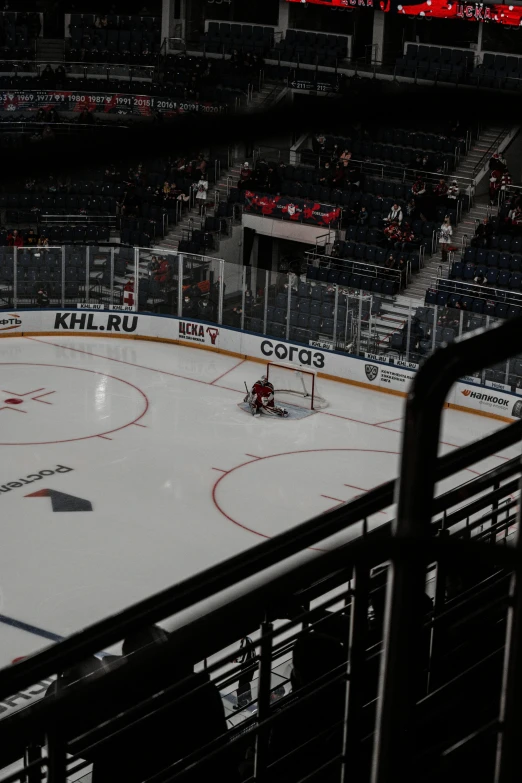 some people are playing hockey on an ice rink