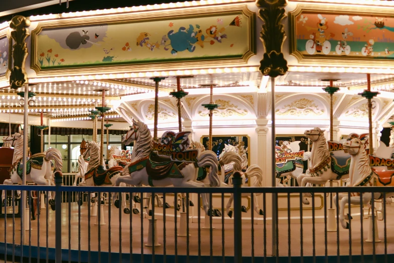 an amut carousel with many horses at night