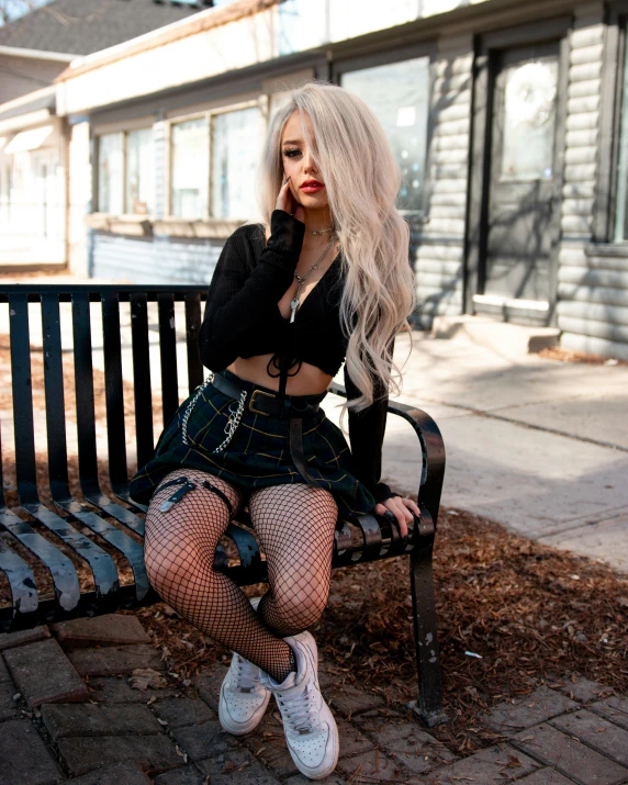 an image of a woman that is sitting on a bench