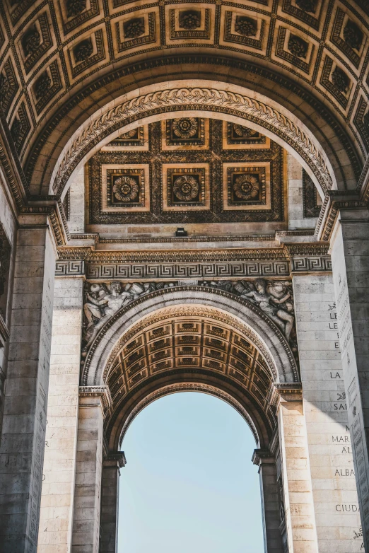 an intricate archway entrance on the side of a large building