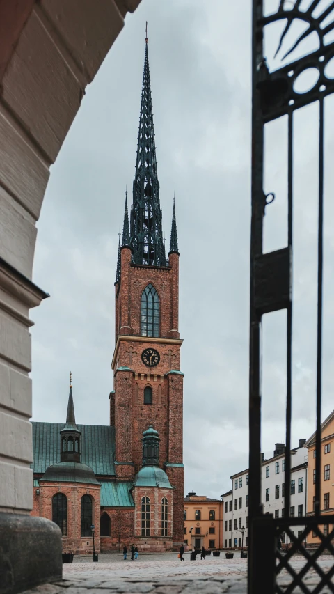 an old building with a steeple with a clock at the top
