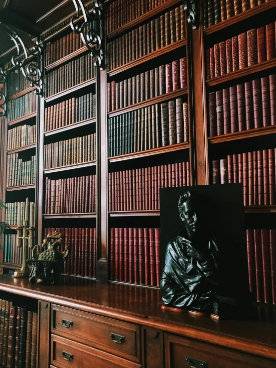 a bookshelf with a lot of books behind it