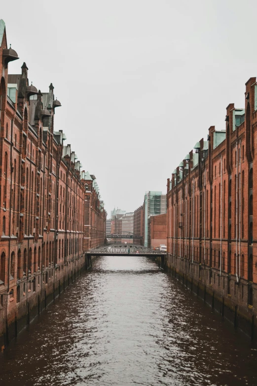 a river running through some tall buildings near the water