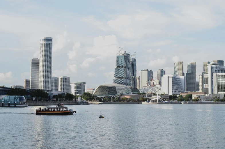 the city skyline and sailboat on the lake