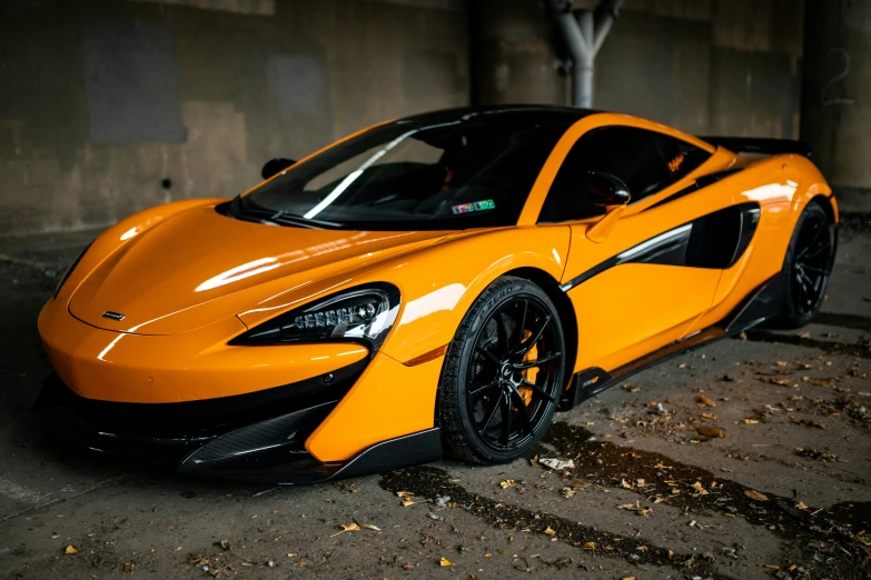 a close up of a yellow car with no background