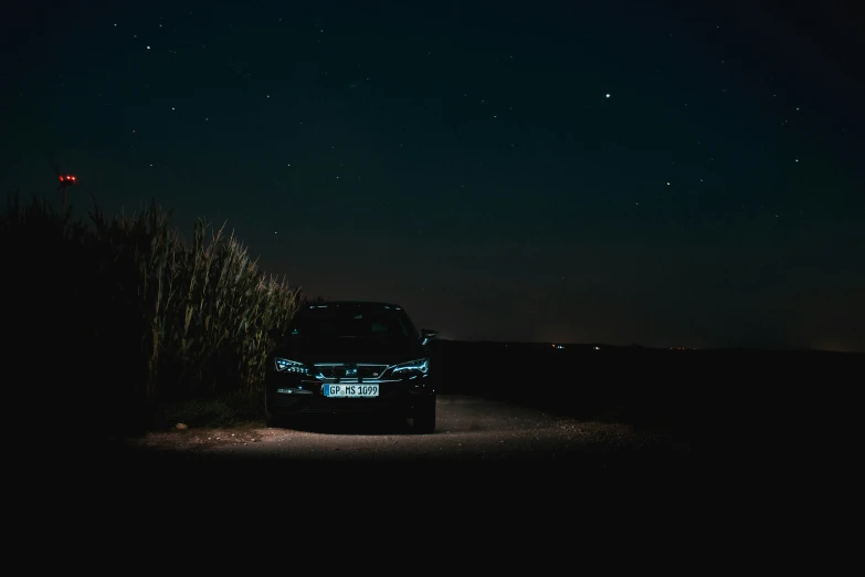 car driving on an empty highway in the dark