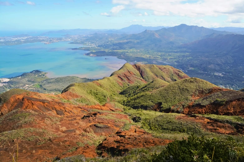 a scenic view of the valley and the ocean