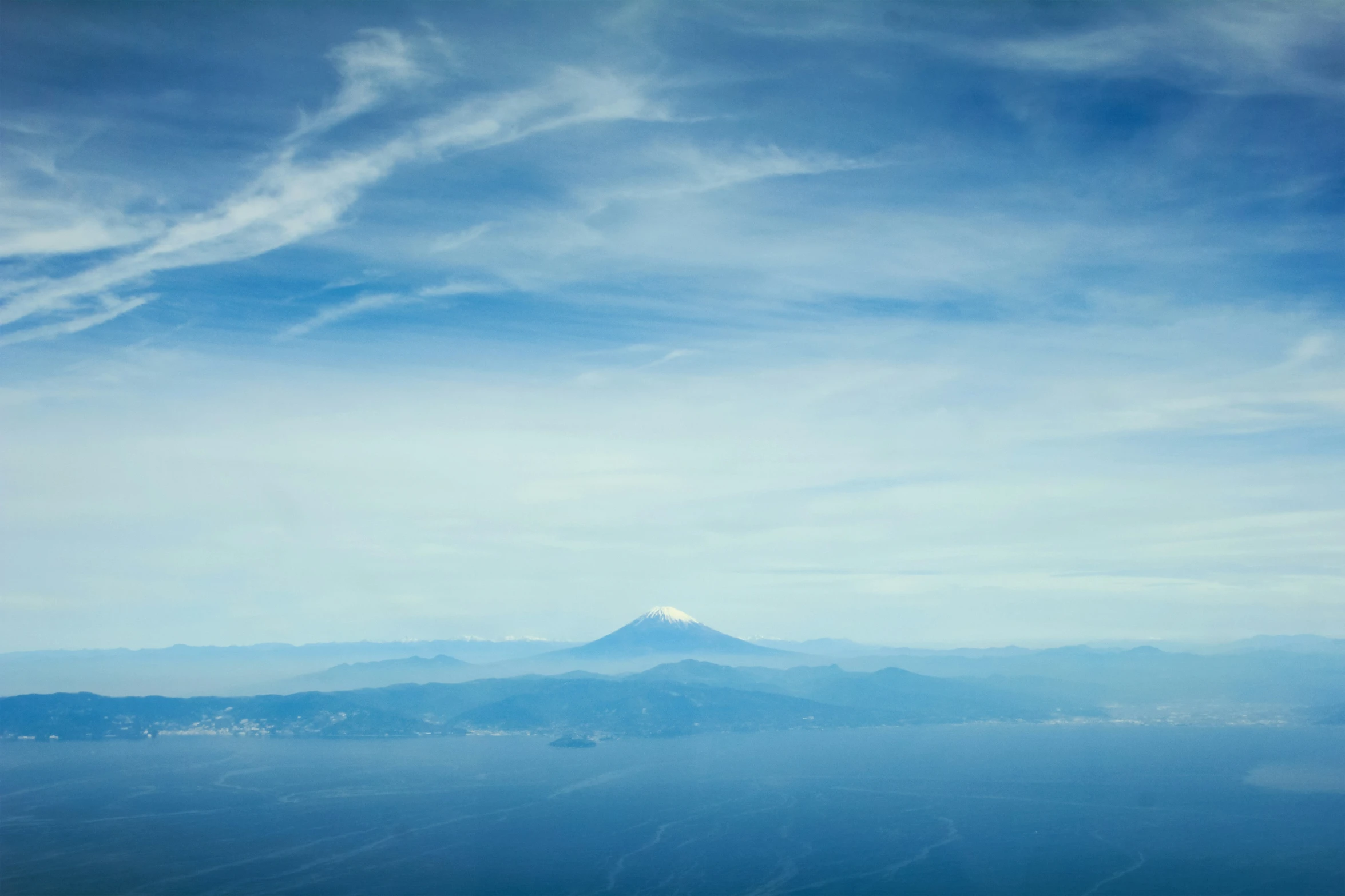 a distant mountain peak sits in the distance