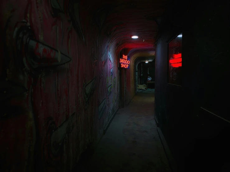 a hallway with graffiti on the wall and graffiti on the door