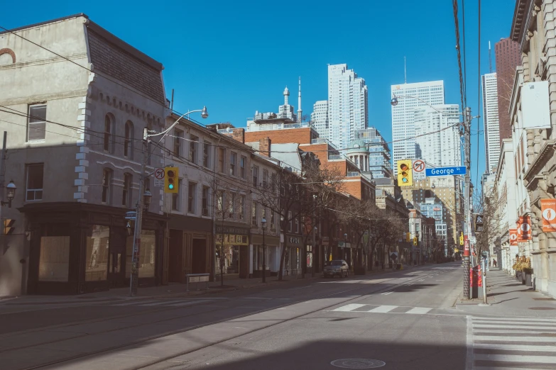 a very old looking city street with some buildings on it