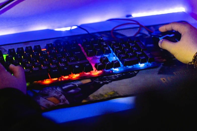 a close up of a persons hands at a keyboard